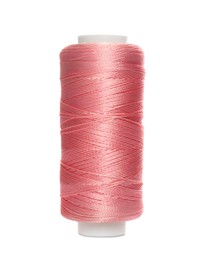 Photo of Spool of pink sewing thread isolated on white