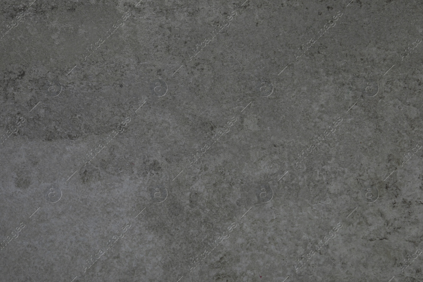 Photo of Texture of grey stone surface as background, closeup