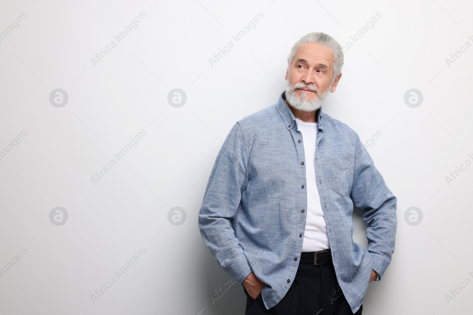 Photo of Portrait of handsome senior man on white background. Space for text