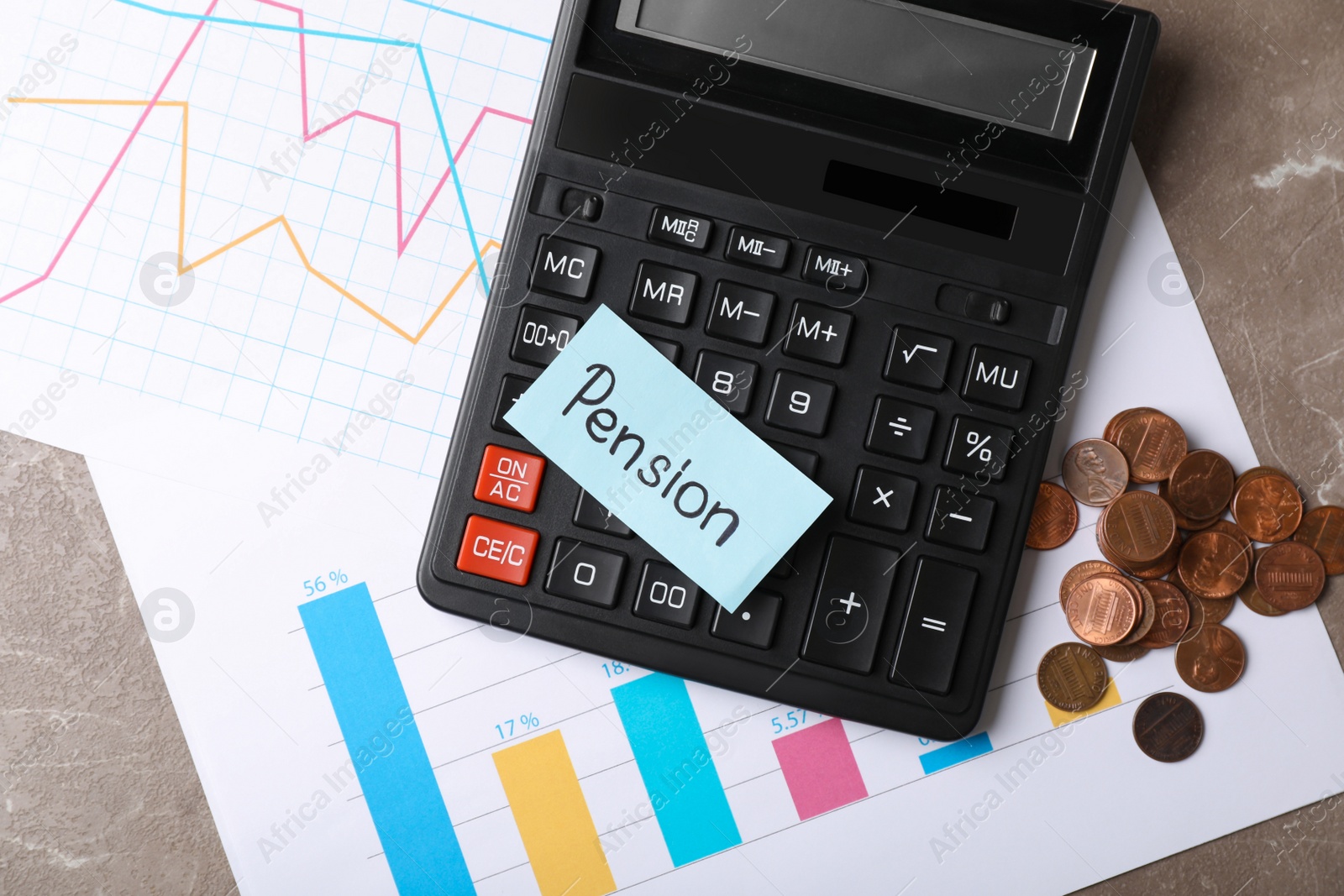 Photo of Paper with word PENSION, charts, coins and calculator on table, top view