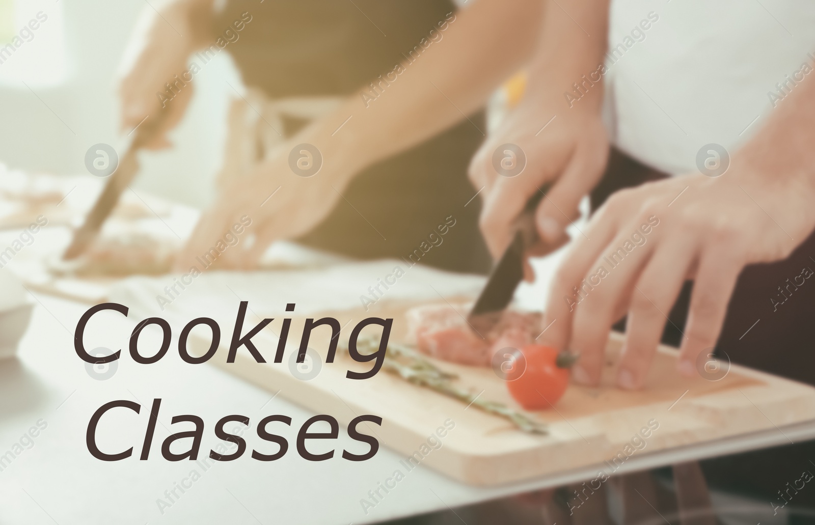 Image of Cooking classes. Blurred view of man cutting meat on wooden board at table, closeup