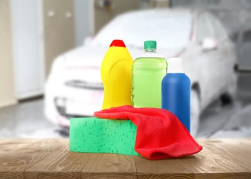 Cleaning supplies on wooden surface at car wash