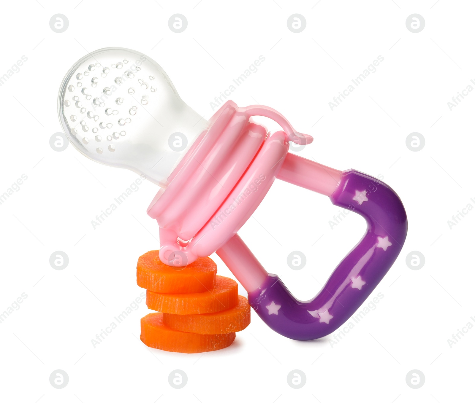Photo of Empty nibbler and boiled carrot on white background. Baby feeder