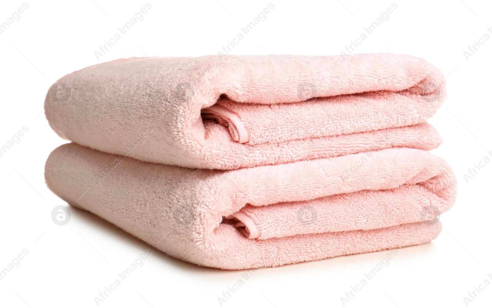 Photo of Folded soft terry towels on white background