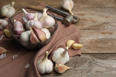 Photo of Fresh garlic on wooden table. Organic product