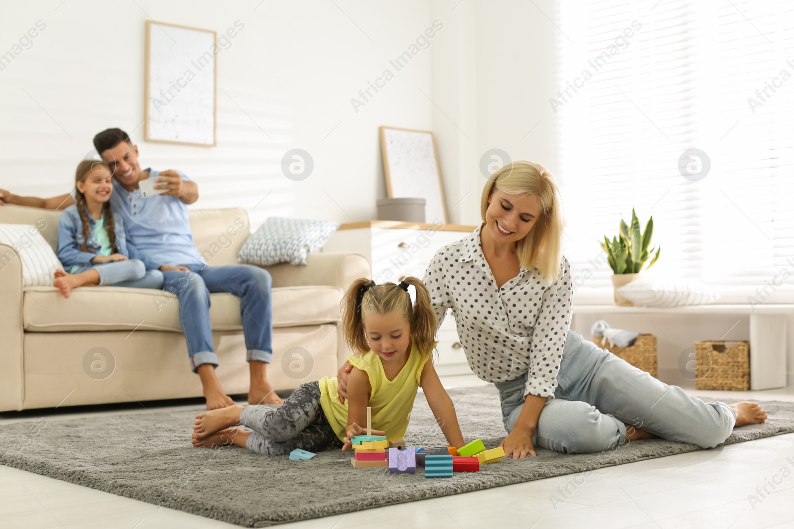 Photo of Happy family spending time together at home