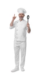 Photo of Happy chef in uniform with spoon pointing at something on white background