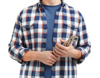 Young plumber with adjustable wrench on white background