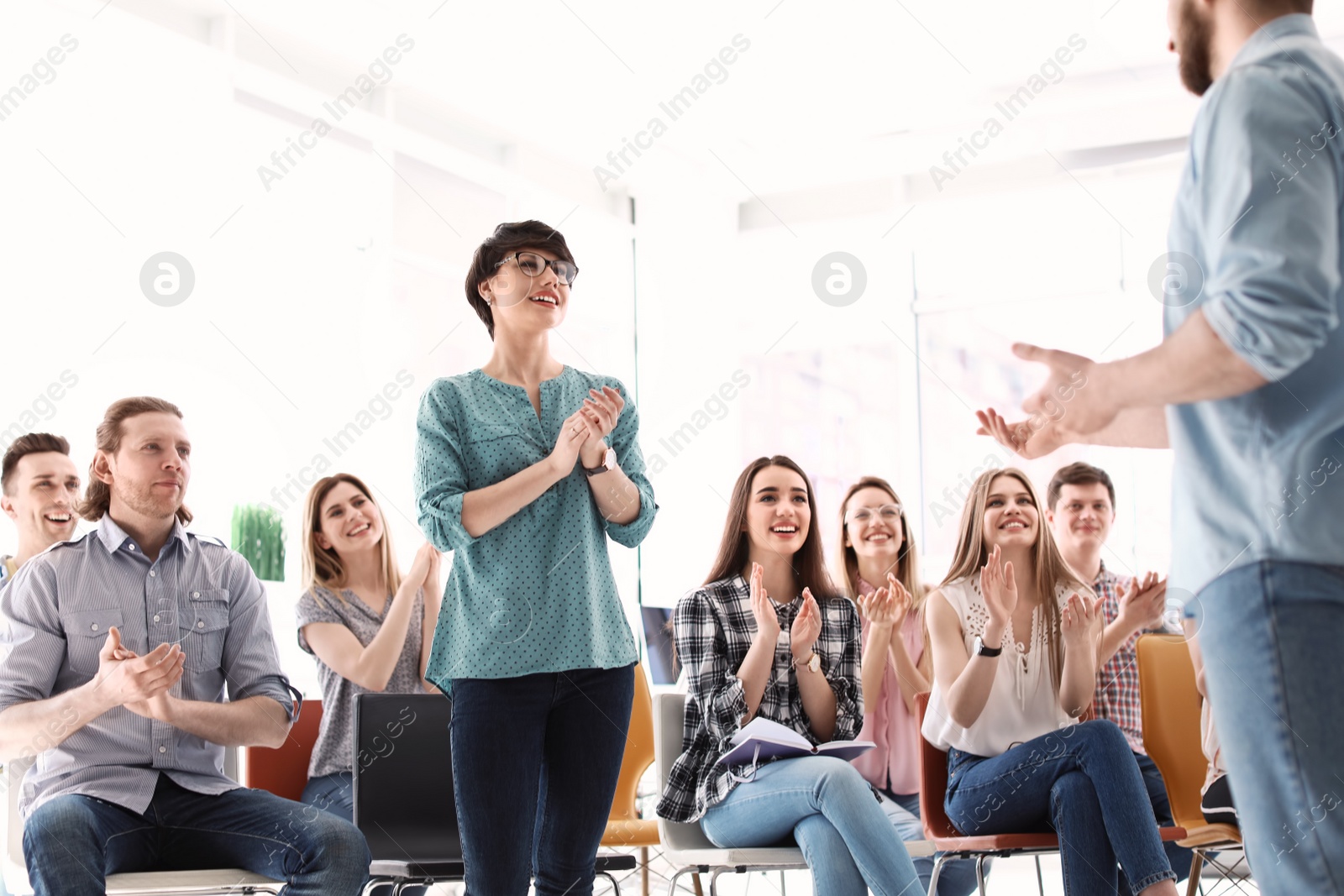 Photo of Male business trainer giving lecture in office