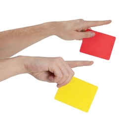 Referee holding cards and pointing on white background, closeup