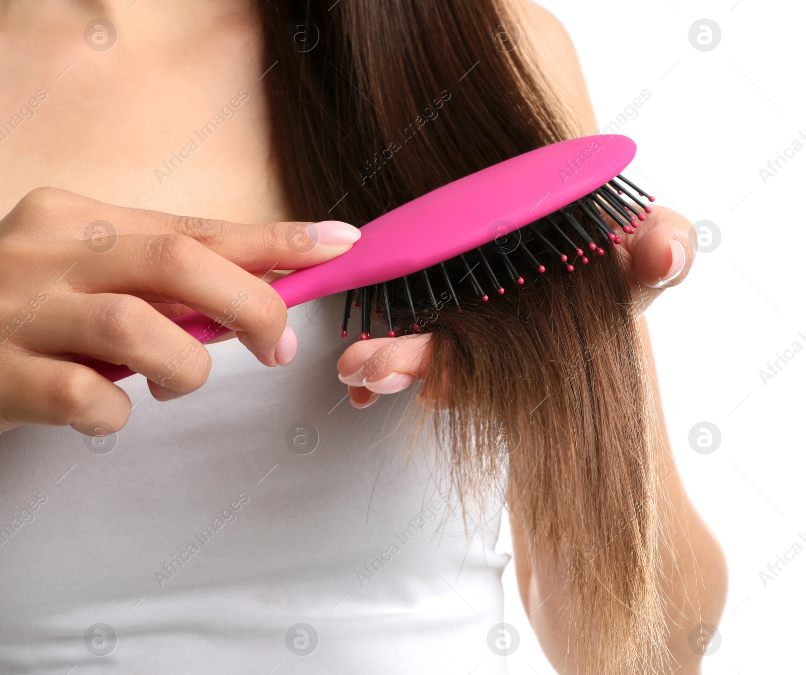 Photo of Woman with hair brush on white background, closeup