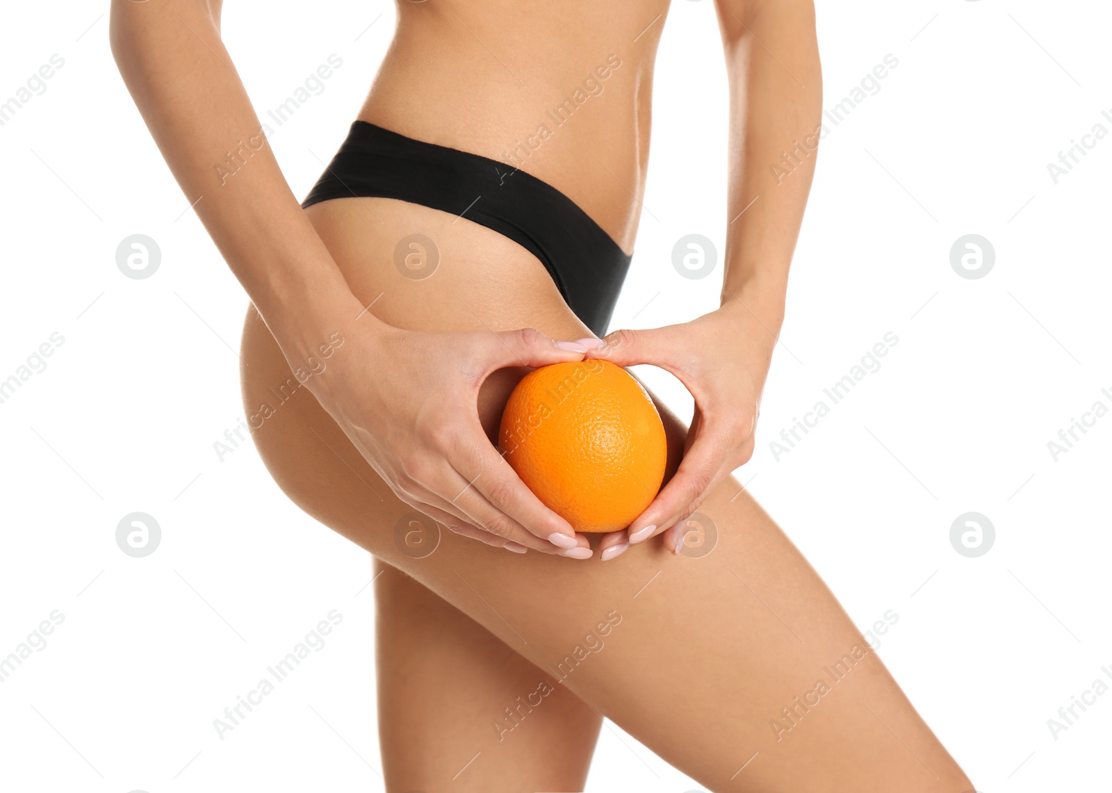 Photo of Closeup view of slim woman in underwear with orange on white background. Cellulite problem concept