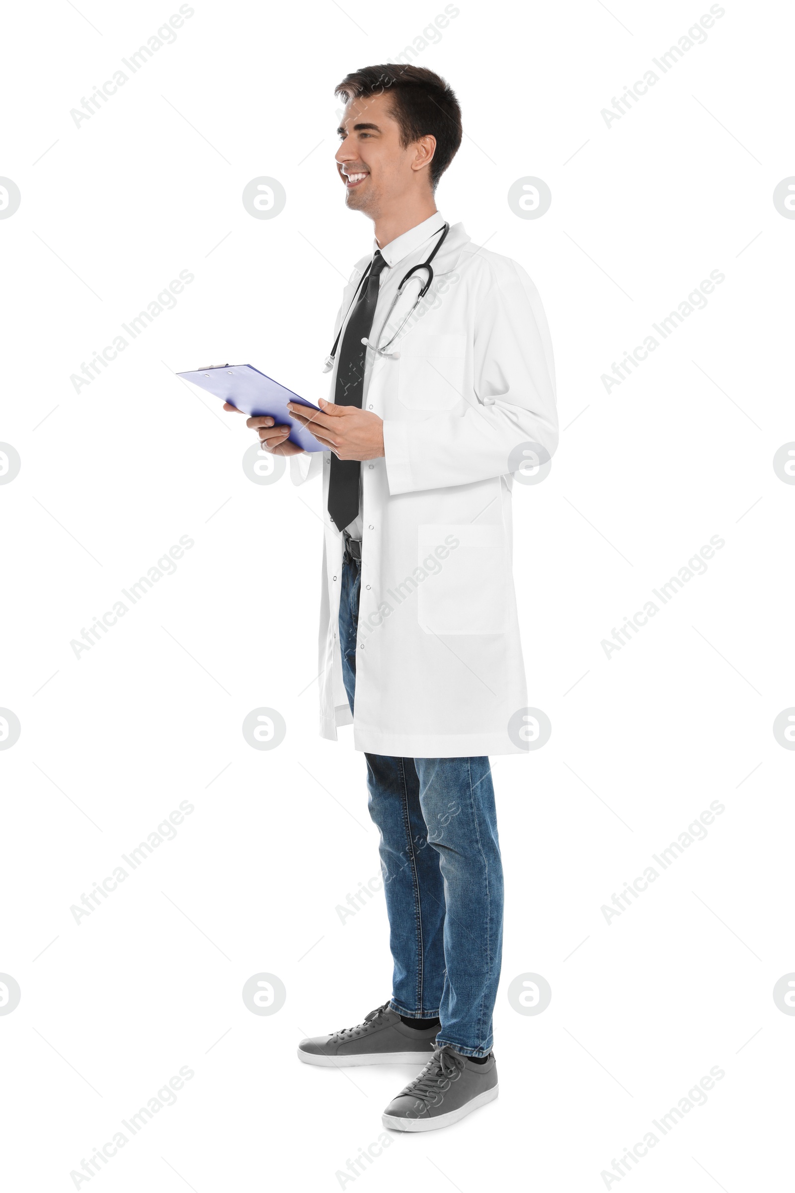 Photo of Full length portrait of medical doctor with clipboard and stethoscope isolated on white