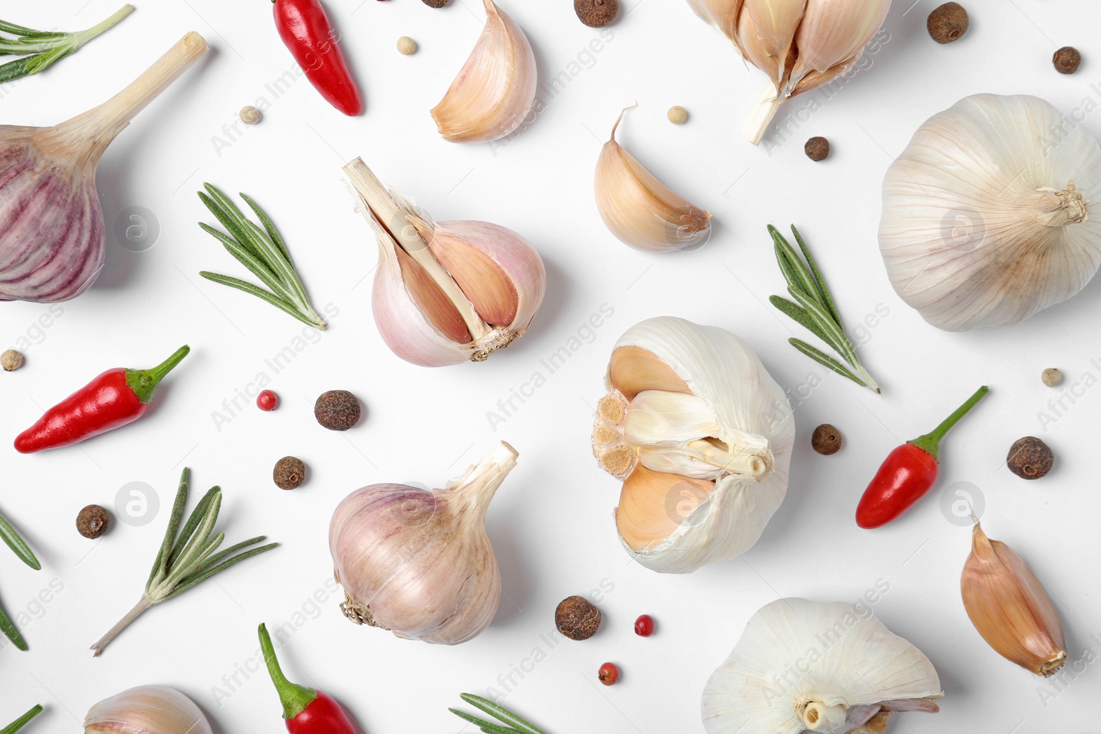 Photo of Composition with garlic, rosemary and peppers on white background, top view