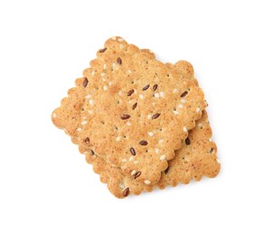 Photo of Stack of cereal crackers with flax and sesame seeds isolated on white, top view