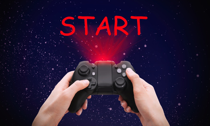 Image of Woman with video game controller and word START against night sky, closeup
