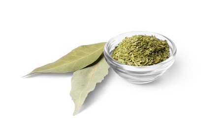 Photo of Whole and ground aromatic bay leaves on white background