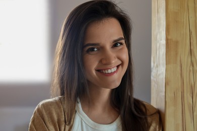 Photo of Portrait of beautiful young woman at home