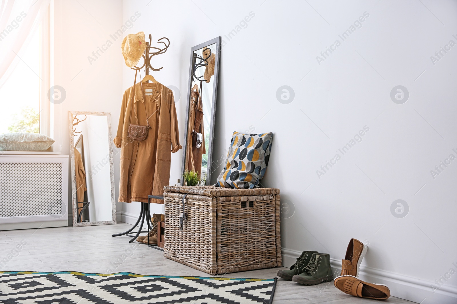 Photo of Stylish hallway interior with mirror and rack