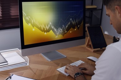 Photo of Businessman working with computer in office, closeup. Forex trading