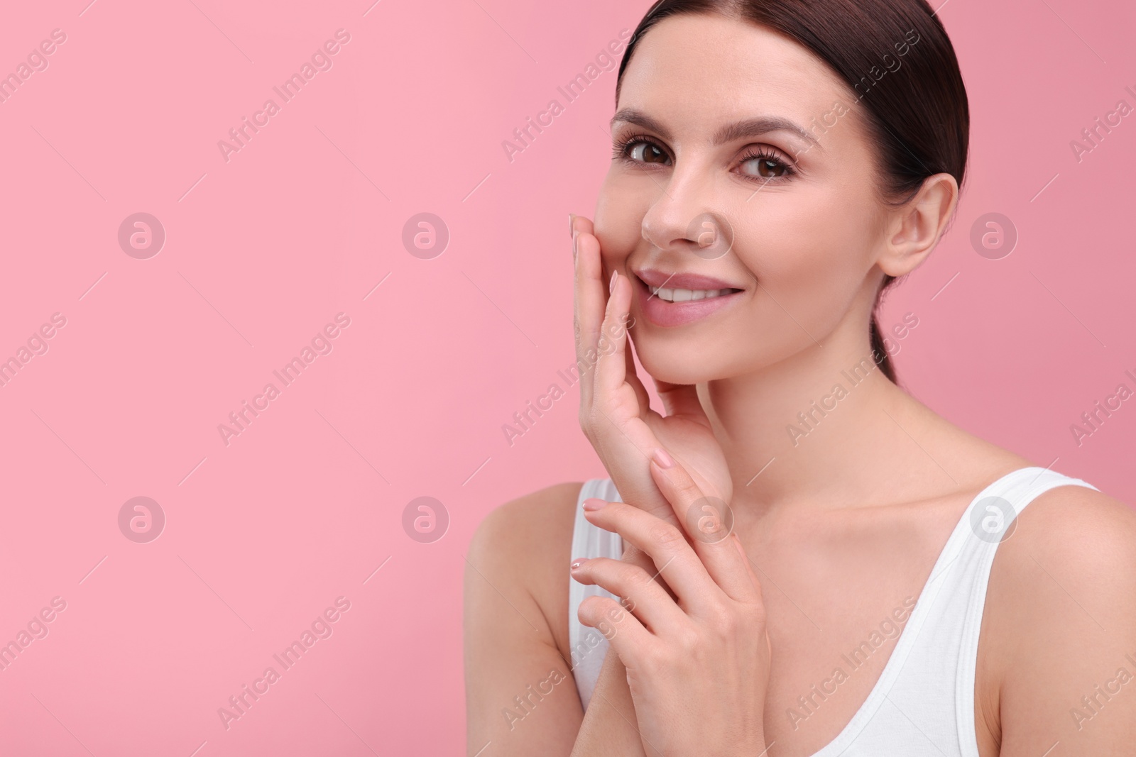 Photo of Beautiful woman with healthy skin on pink background, space for text. Body Care