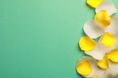 Photo of Beautiful petals on green background, flat lay. Space for text