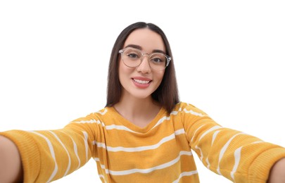 Photo of Smiling young woman taking selfie on white background