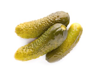 Tasty crunchy pickled cucumbers on white background, top view