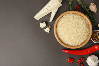 Photo of Flat lay composition with different ingredients on grey background, space for text. Risotto recipe