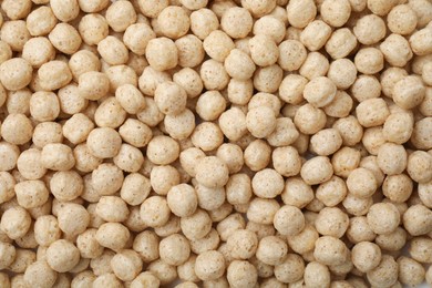 Photo of Tasty sweet cereal balls as background, top view