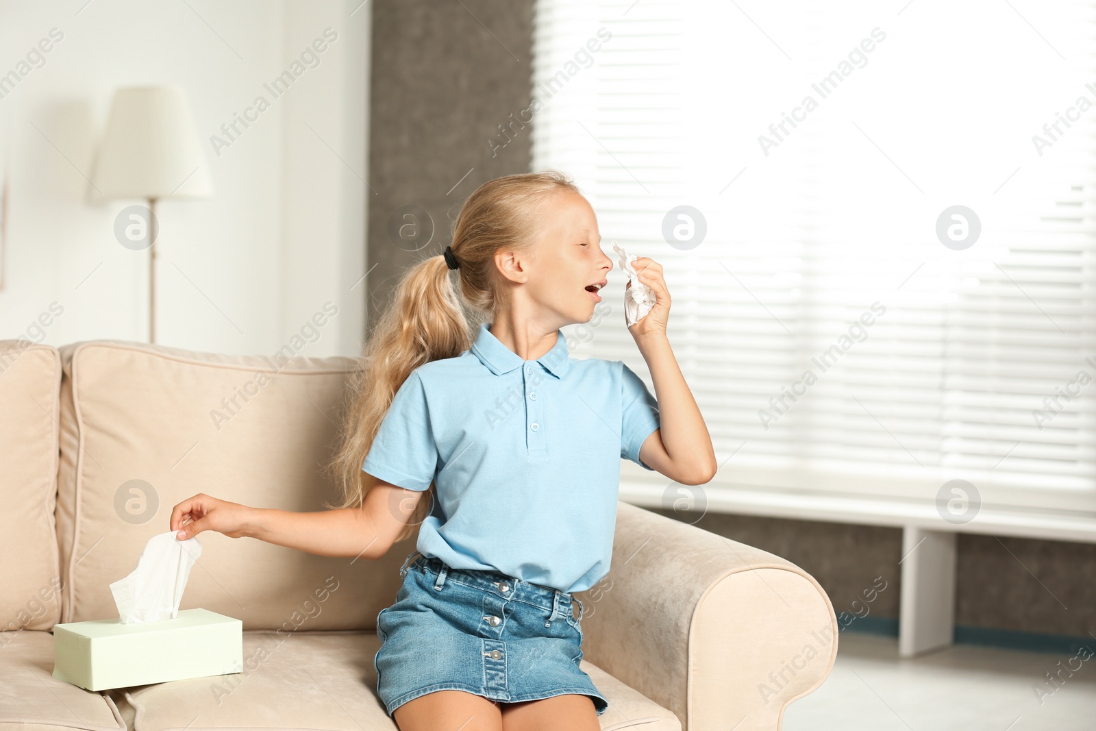 Photo of Little girl suffering from allergy at home