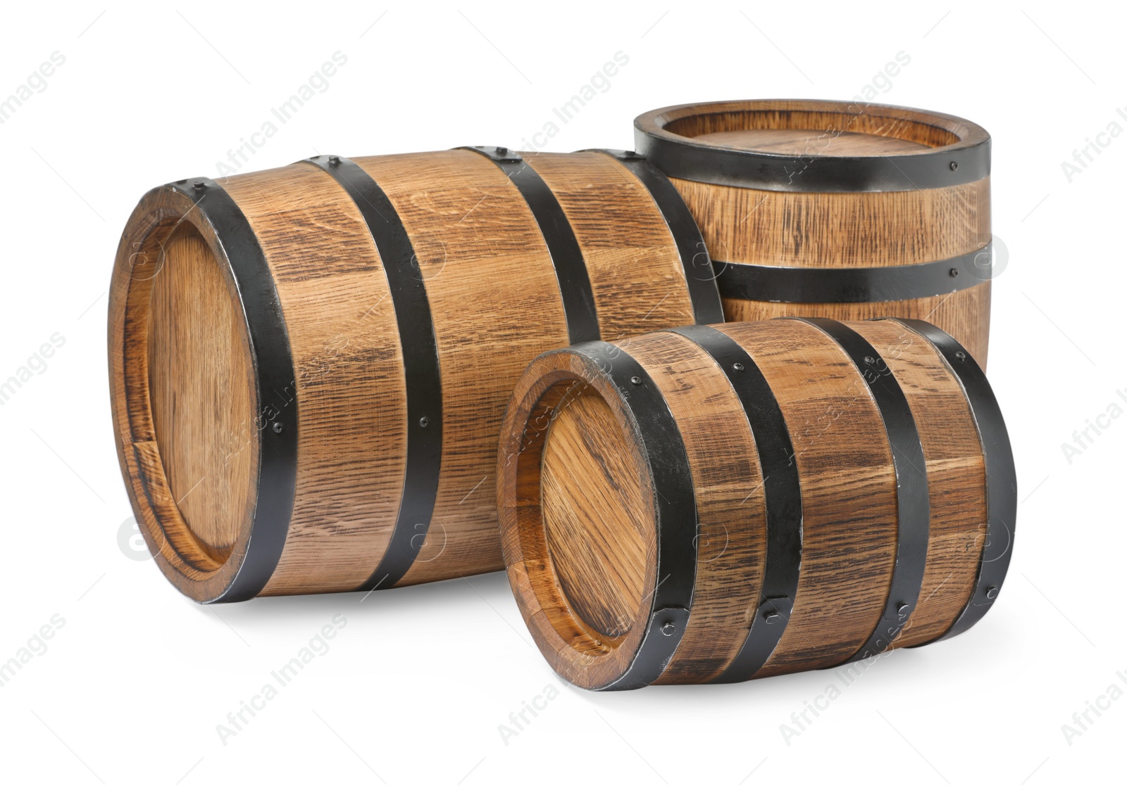 Photo of Three traditional wooden barrels on white background