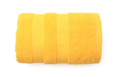 Photo of Rolled yellow terry towel isolated on white, top view