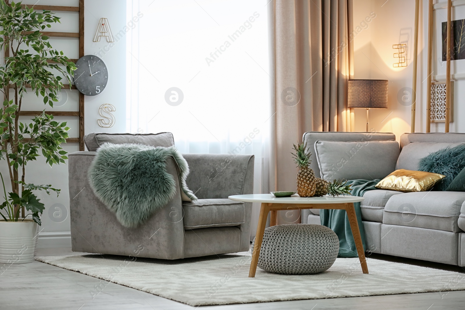 Photo of Stylish living room interior with comfortable sofa and armchair