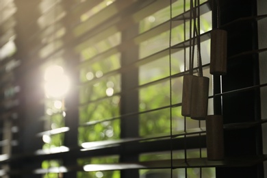 Photo of Closeup view of sunlit horizontal window blinds