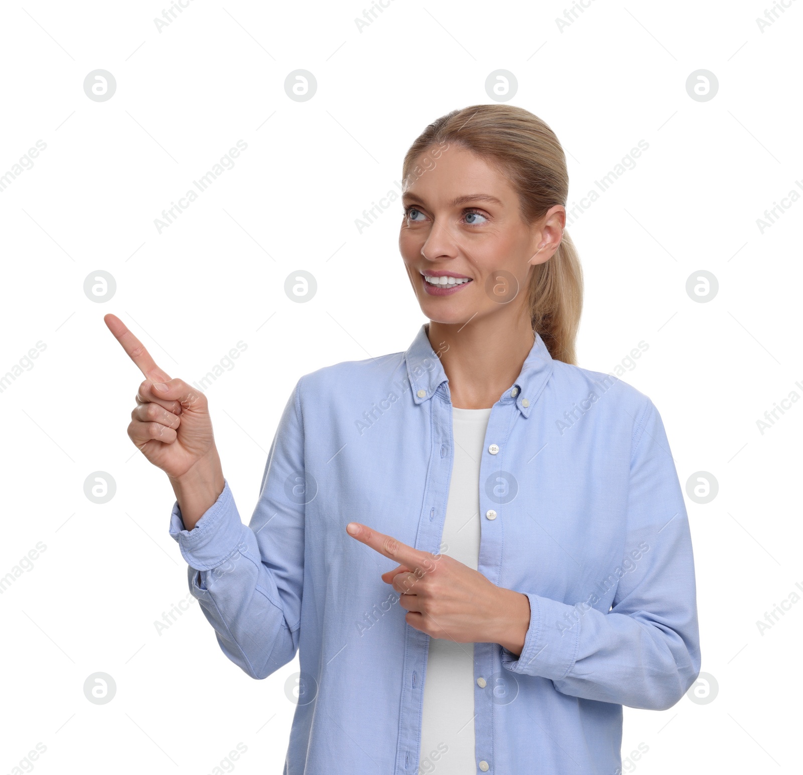 Photo of Special promotion. Smiling woman pointing at something on white background