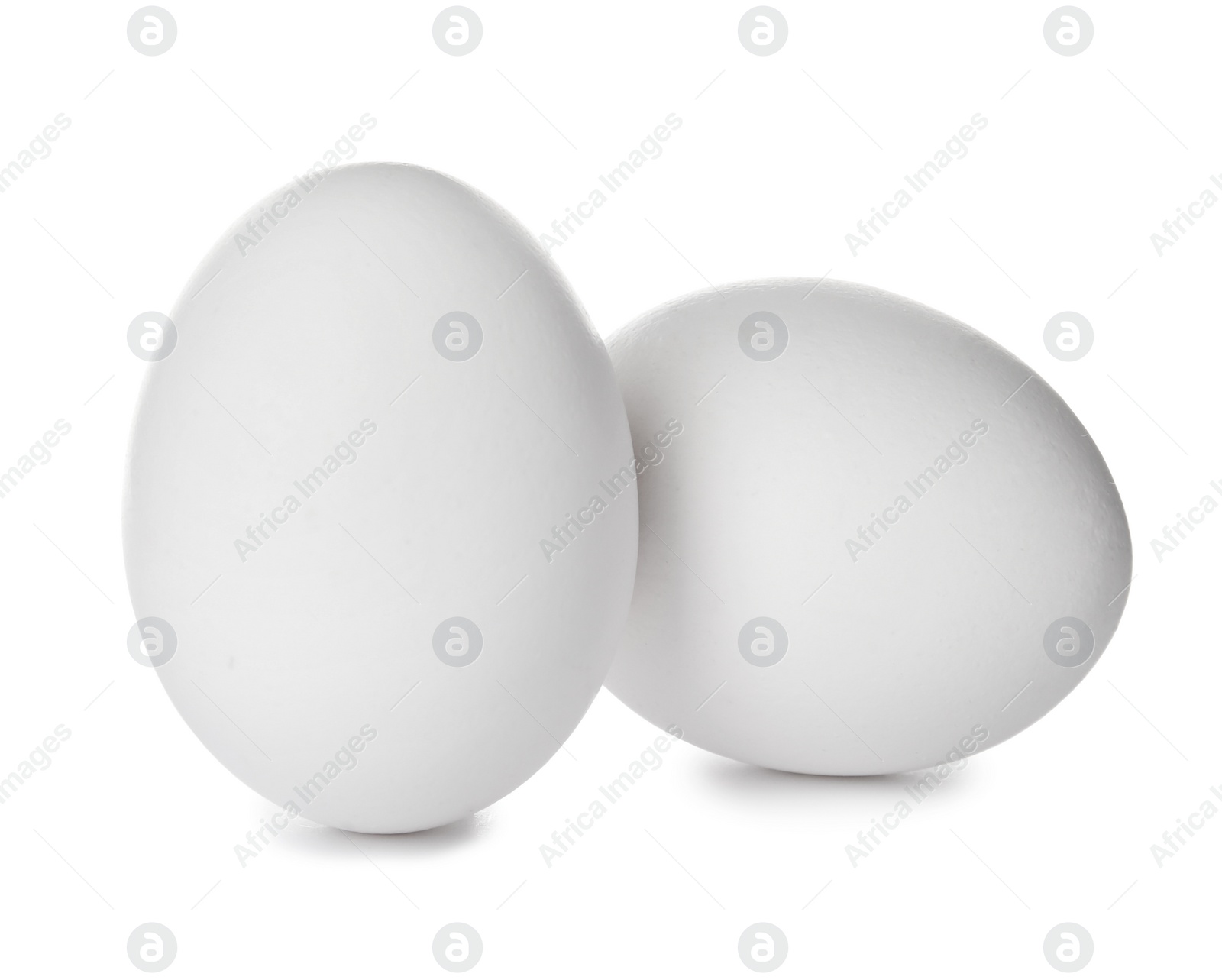 Photo of Few raw chicken eggs on white background