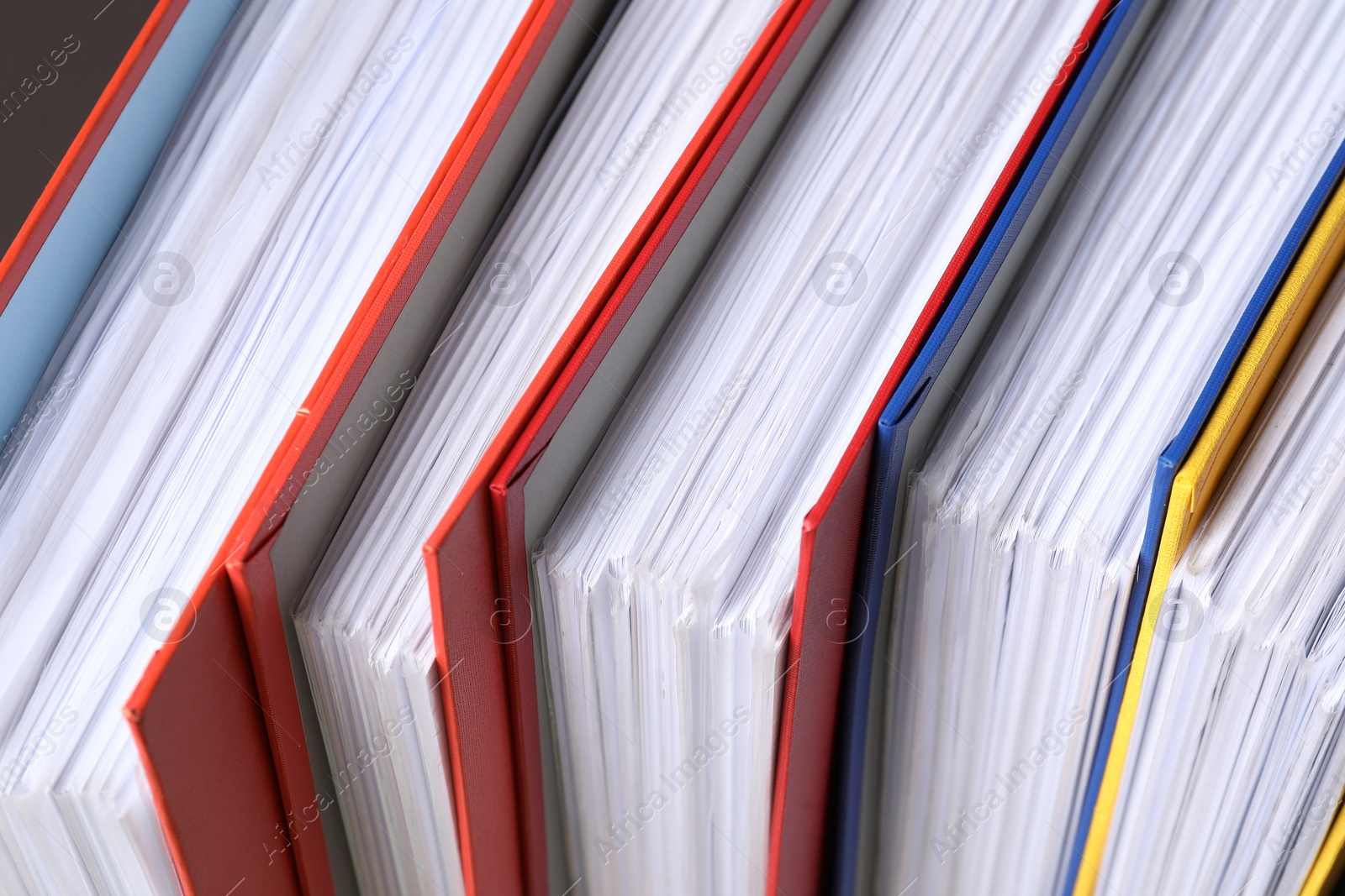 Photo of Colorful binder office folders as background, closeup