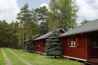 Beautiful wooden beach houses and green trees outdoors