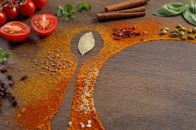 Photo of Silhouettes of spoon and plate made with spices and ingredients on wooden table