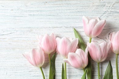 Photo of Beautiful composition with tulips for Mother's Day on wooden background