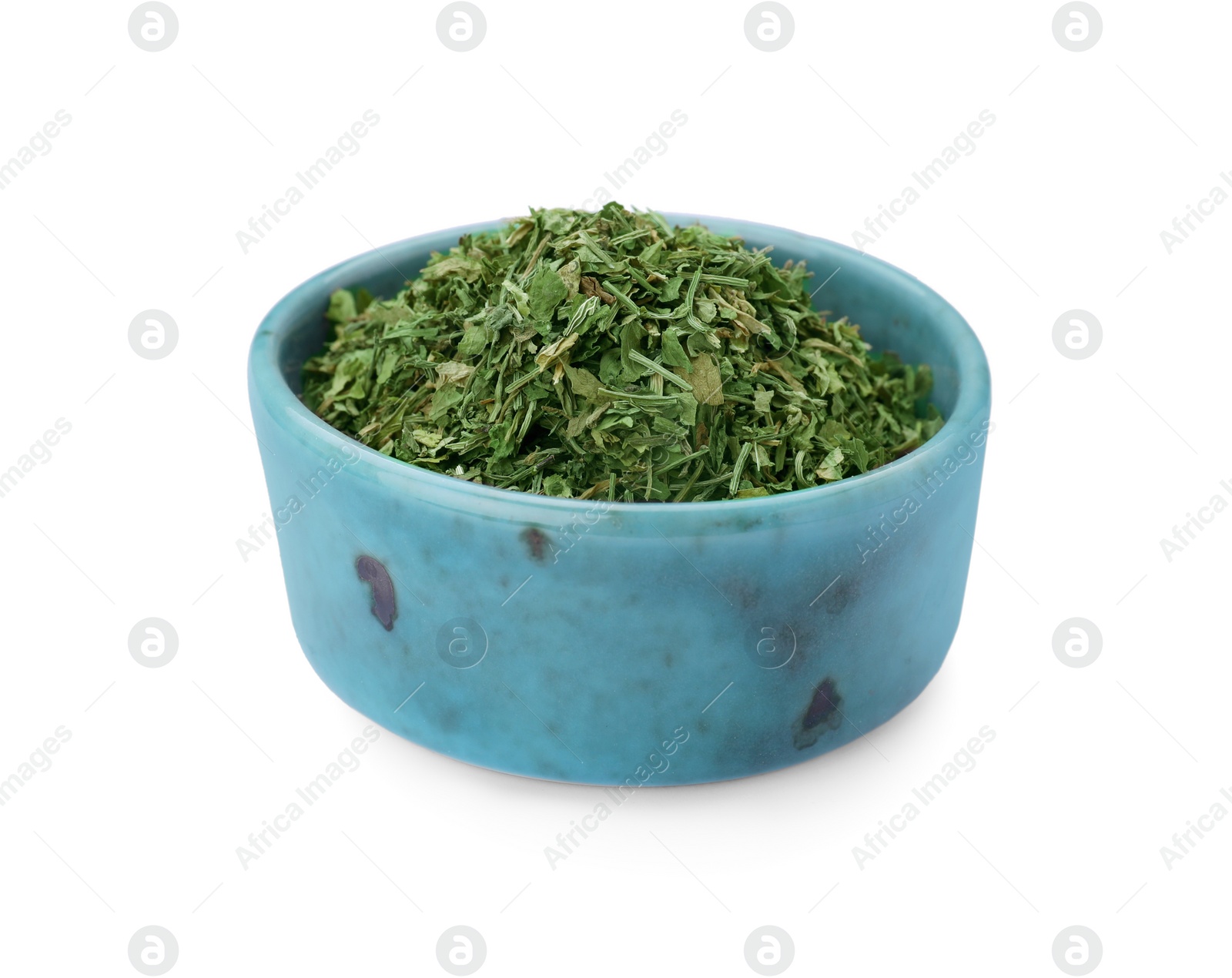 Photo of Dried aromatic parsley in bowl isolated on white