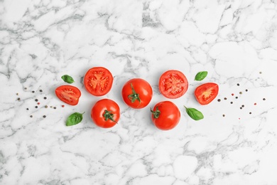 Photo of Flat lay composition with ripe tomatoes on marble background