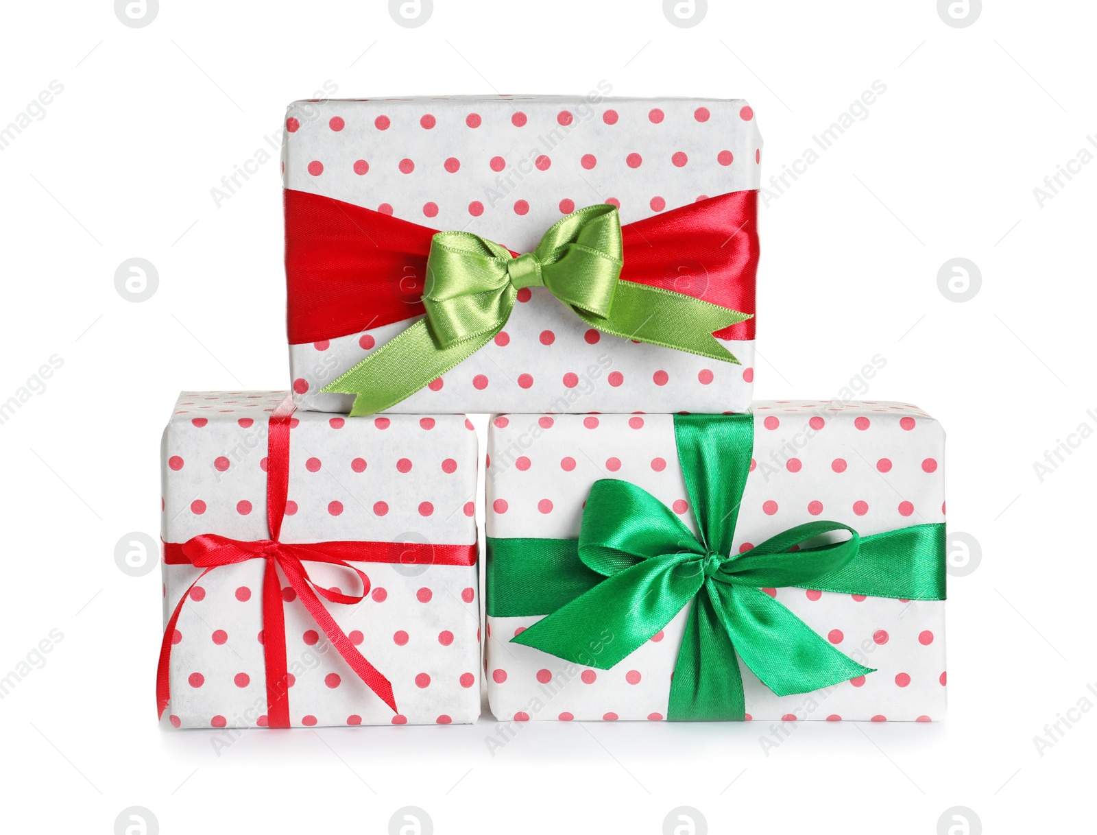 Photo of Beautifully wrapped gift boxes on white background