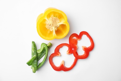 Photo of Cut ripe paprika pepper on white background, top view