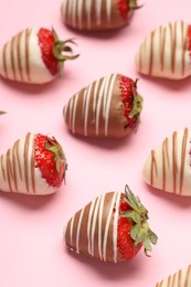 Photo of Delicious chocolate covered strawberries on pink background