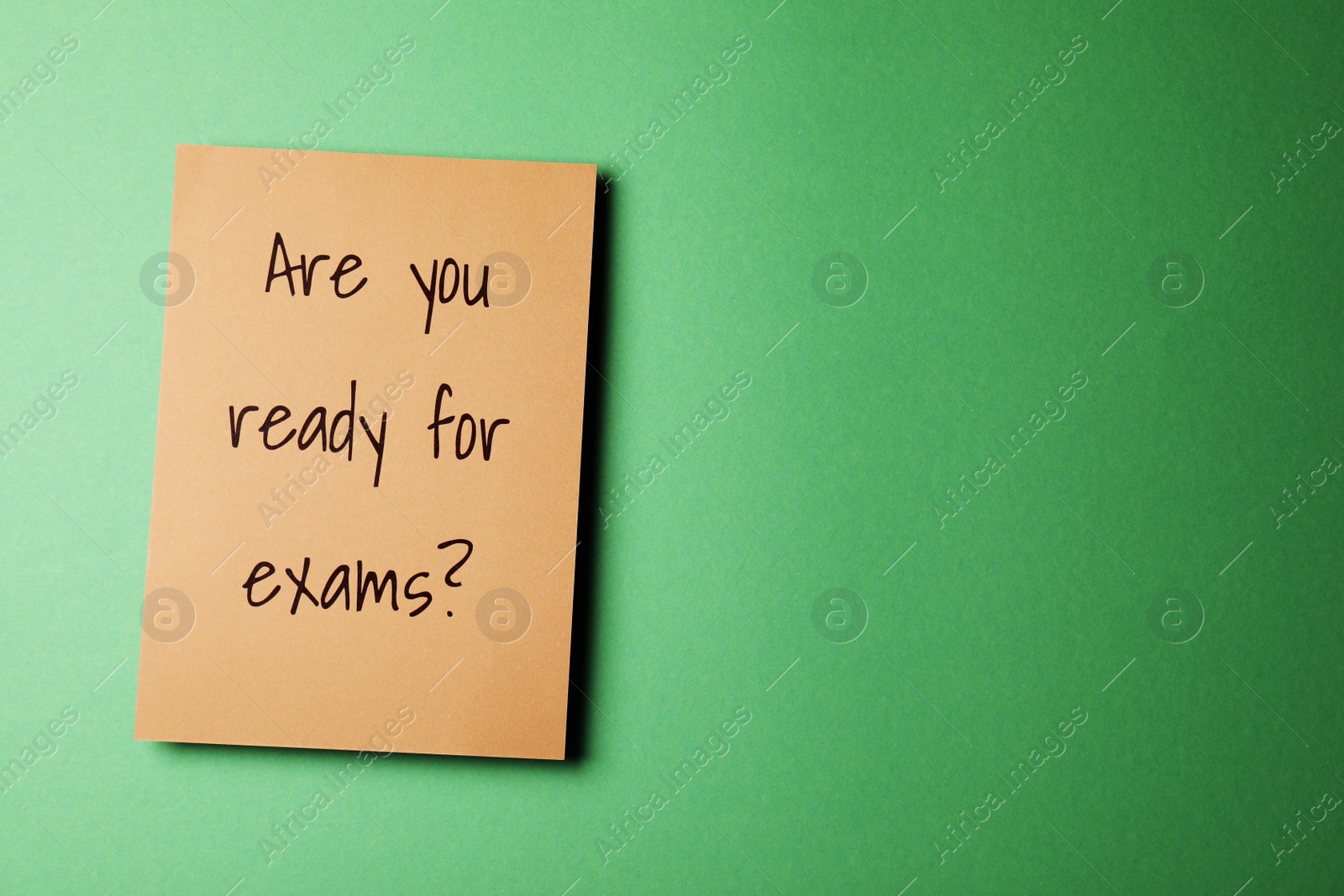Photo of Paper with question Are you ready for exams on green background, top view. Space for text