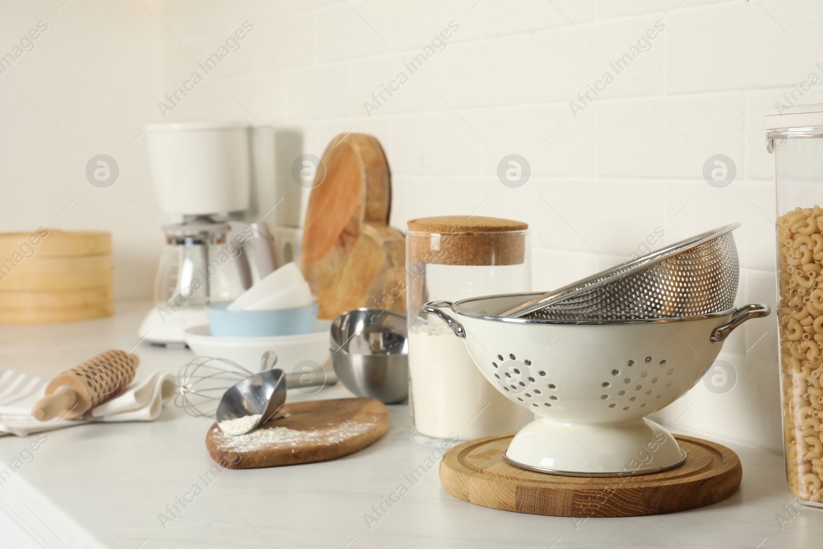 Photo of Cooking utensils and products on kitchen counter