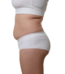 Photo of Woman with excessive belly fat on white background, closeup. Overweight problem