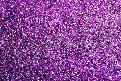 Beautiful shiny purple glitter as background, closeup